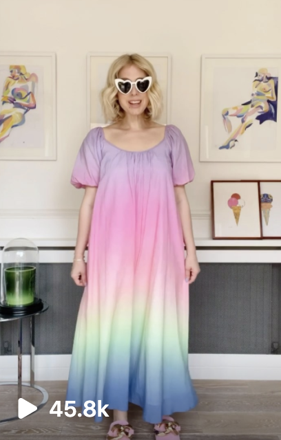 olivia rubin in a rainbow colour dress creating a reel