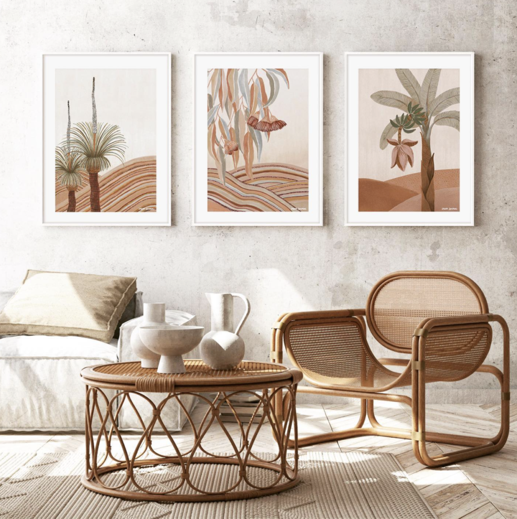 lounge room with two cane chairs and karina jambrak wall art