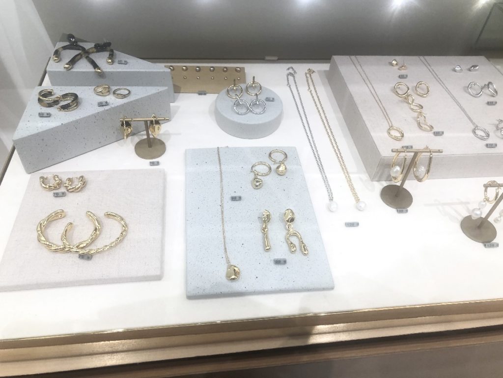 Display showing necklaces and jewellery on thelotco retail store visit