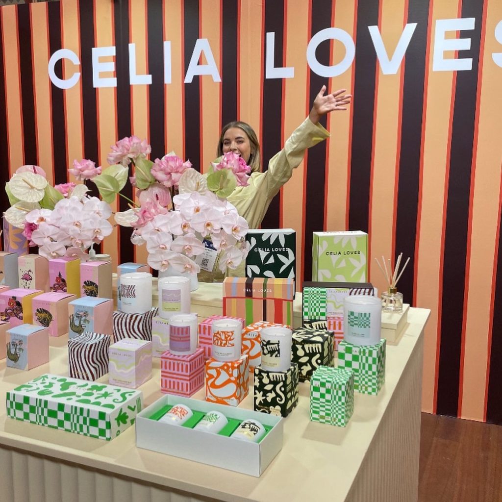 Image showing Celia loves candles trade show booth at life in style in Melbourne with stripe wallpaper background 